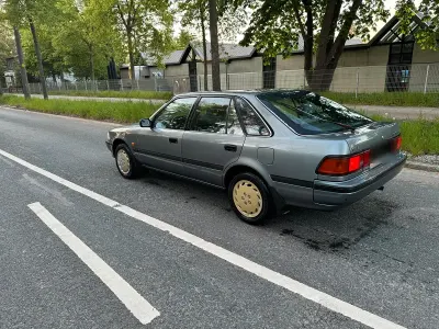 Usata Toyota Carina 72 CV (52 kW) 1990 Argento Berlina