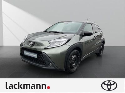 Gebraucht Toyota Aygo X Pulse 72 PS (52 kW) 2023 6w4)/ black mica (209) (gruen SUV