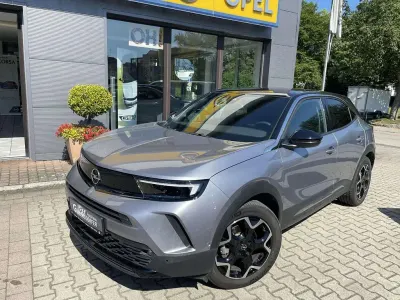 Gebraucht Opel Mokka-e Ultimate 100 kW (136 PS) 2024 Kontrast grau / dach schwarz SUV