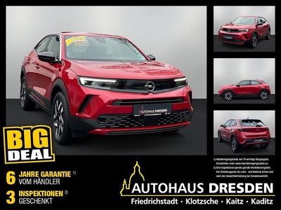 Gebraucht Opel Mokka Elegance 101 PS (74 kW) 2024 Kosmos rot (metallic) SUV