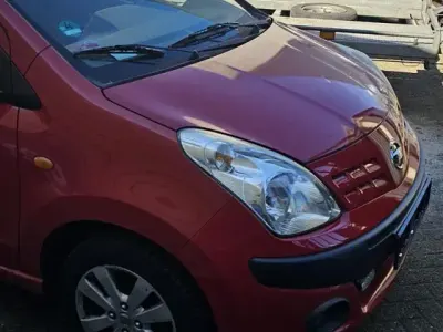 Gebraucht Nissan Pixo 68 PS (50 kW) 2011 Rot Kleinwagen