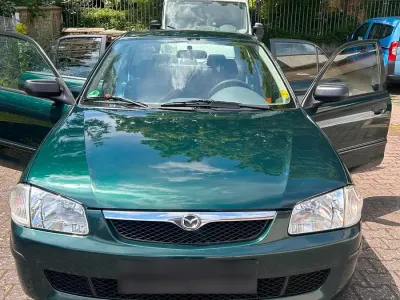 Gebraucht Mazda 323 75 PS (55 kW) 1999 Grün Limousine