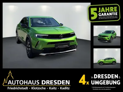 Gebraucht Opel Mokka-e Elegance 100 kW (136 PS) 2022 Matcha green (metallic) SUV