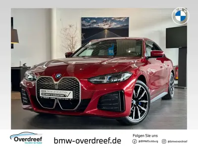 Gebraucht BMW i4 250 kW (340 PS) 2025 Dragon fire rot metallic Limousine