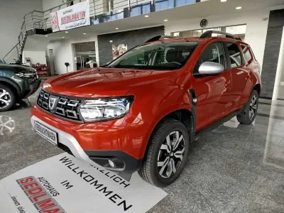 Używany Dacia Duster Prestige 101 KM (74 kW) 2021 Pomarańczowy SUV