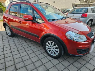 Usata Suzuki SX4 Style 120 CV (88 kW) 2011 Arancione Berlina