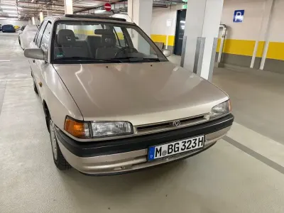 Gebraucht Mazda 323 88 PS (64 kW) 1992 Braun Limousine