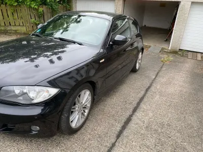 Gebraucht BMW 116 122 PS (89 kW) 2010 Schwarz Kleinwagen