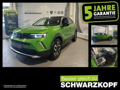 Gebraucht Opel Mokka-e Elegance 100 kW (136 PS) 2023 Matcha green/ikone gruen SUV