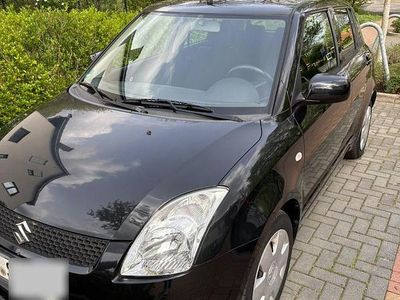 Second-hand Suzuki Swift Club 92 CP (67 kW) 2009 Negru Hatchback