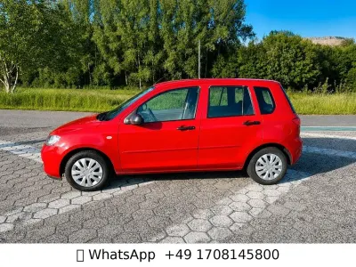 Używany Mazda 2 Comfort 75 KM (55 kW) 2004 Czerwony Hatchback