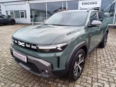 Neu Dacia Duster Journey 101 PS (74 kW) 2025 Zederngrün SUV