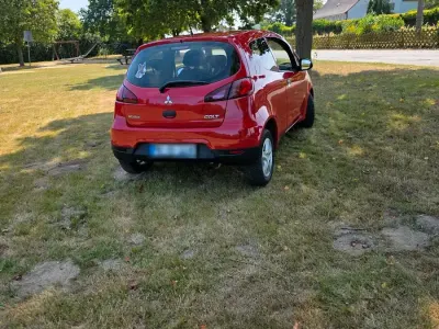 Gebraucht Mitsubishi Colt 75 PS (55 kW) 2012 Rot Kleinwagen