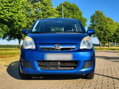 Gebraucht Daihatsu Cuore 70 PS (51 kW) 2010 Blau Kleinwagen