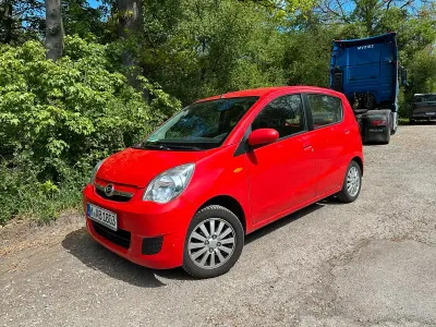 Gebraucht Daihatsu Cuore 69 PS (50 kW) 2010 Rot Kleinwagen