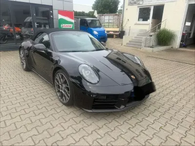 Gebraucht Porsche 911 Carrera Cabriolet 394 PS (289 kW) 2025 Tiefschwarz Cabrio