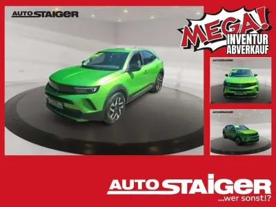 Gebraucht Opel Mokka Elegance 101 PS (74 kW) 2024 Lackierung matcha green/typ au SUV