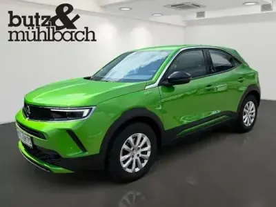 Gebraucht Opel Mokka-e 100 kW (136 PS) 2021 Matcha green (metallic) SUV