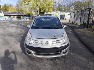 Second-hand Nissan Pixo 68 CP (50 kW) 2010 Argintiu Hatchback