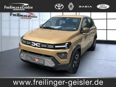 Gebraucht Dacia Spring Extreme 47 kW (65 PS) 2025 Beige safari (metallic) Kleinwagen