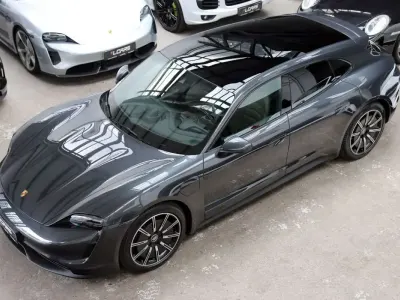 Gebraucht Porsche Taycan Sport Turismo 350 kW (476 PS) 2023 Vulkangrau Kombi