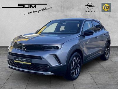 Gebraucht Opel Mokka-e Elegance 100 kW (136 PS) 2023 Kontrast grau/quarz silber SUV