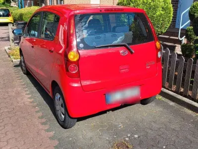 Gebraucht Daihatsu Cuore 69 PS (50 kW) 2009 Rot Kleinwagen