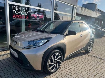 Gebraucht Toyota Aygo X Pulse 72 PS (52 kW) 2023 Ginger beige met./dach schwarz SUV