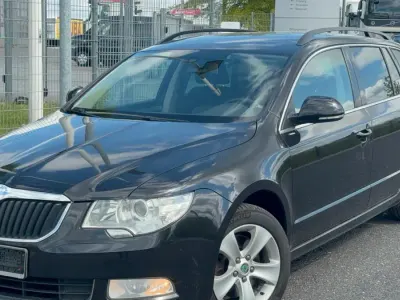 Używany Skoda Superb 140 KM (102 kW) 2012 Czarny Kombi