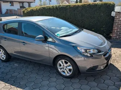 Usado Opel Corsa drive 95 HP (69 kW) 2015 Cinzento Citadino