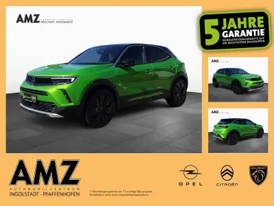 Gebraucht Opel Mokka Ultimate 131 PS (96 kW) 2023 Lackierung matcha green/typ au SUV