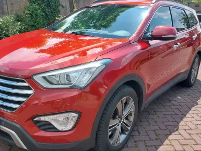 Gebraucht Hyundai Grand Santa Fe 197 PS (144 kW) 2015 Rot SUV