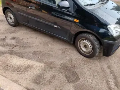 Gebraucht Daihatsu Cuore 58 PS (42 kW) 2006 Schwarz Kleinwagen