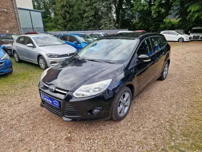 Gebraucht Ford Focus 101 PS (74 kW) 2014 Pantherschwarz metallic Kombi