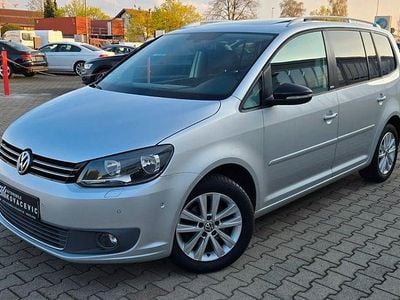 Second-hand VW Touran Style 105 CP (77 kW) 2011 Argintiu Monovolum