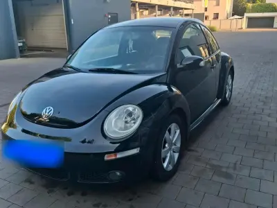 Gebraucht VW New Beetle 75 PS (55 kW) 2007 Schwarz Kleinwagen