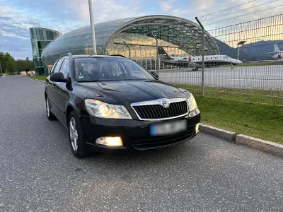 Używany Skoda Octavia 105 KM (77 kW) 2013 Czarny Kombi