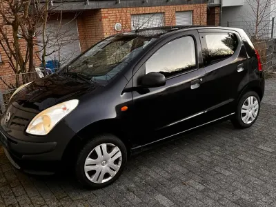 Gebraucht Nissan Pixo 68 PS (50 kW) 2010 Schwarz Kleinwagen