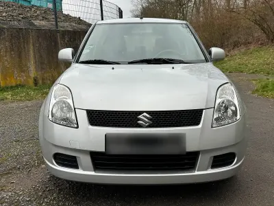 Używany Suzuki Swift 92 KM (67 kW) 2006 Srebrny Hatchback