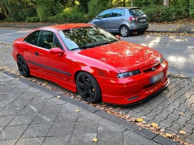 Second-hand Opel Calibra 170 CP (125 kW) 1997 Roșu Coupe