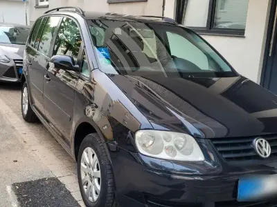 Używany VW Touran Basis 101 KM (74 kW) 2003 Czarny Minivan