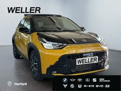 Gebraucht Toyota Aygo X Sport 116 PS (85 kW) 2026 5c5)/ black mica (209) (gold SUV