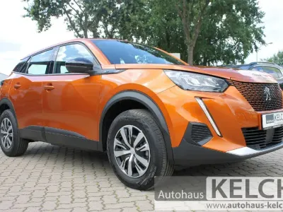 Gebraucht Peugeot e-2008 Active 100 kW (136 PS) 2023 Orange SUV