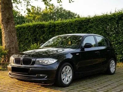 Gebraucht BMW 116 122 PS (89 kW) 2010 Schwarz Kleinwagen