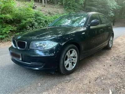 Gebraucht BMW 116 122 PS (89 kW) 2010 Schwarz Kleinwagen