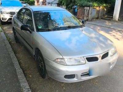 Occasion Mitsubishi Carisma 90 PK (66 kW) 1997 Grijs Sedan