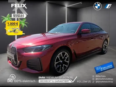 Gebraucht BMW i4 M Sport 250 kW (340 PS) 2025 Dragon fire rot metallic Limousine
