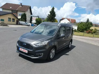Gebraucht Ford Tourneo Connect Titanium 120 PS (88 kW) 2018 Magneticgrau (metallic) Van / Kleinbus