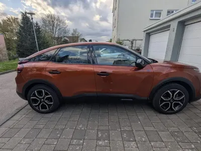 Second-hand Citroën e-C4 100 kW (136 CP) 2022 Portocaliu Berlinǎ