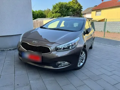 Gebraucht Kia Ceed Sportswagon DREAM-TEAM Edition 135 PS (99 kW) 2013 Braun Kombi